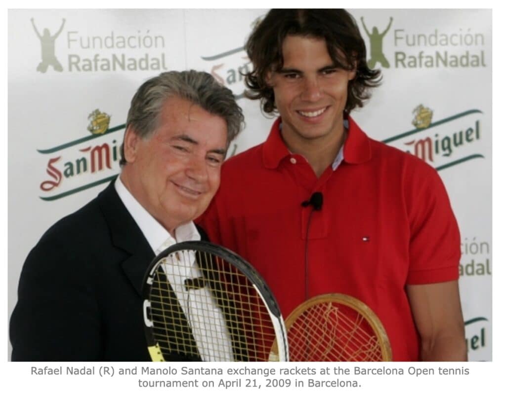 Rafael Nadal (R) and Manolo Santana exchange rackets at the Barcelona Open tennis tournament on April 21, 2009 in Barcelona.